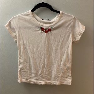 Brandy: White T-Shirt with Red Floral Detailing
